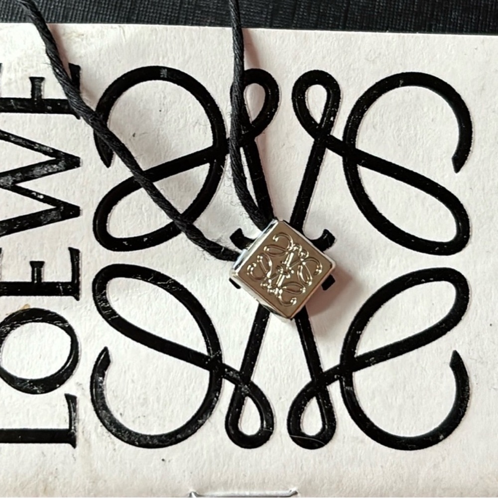 LOEWE SILVER CHARM BRACELET WITH BOX.